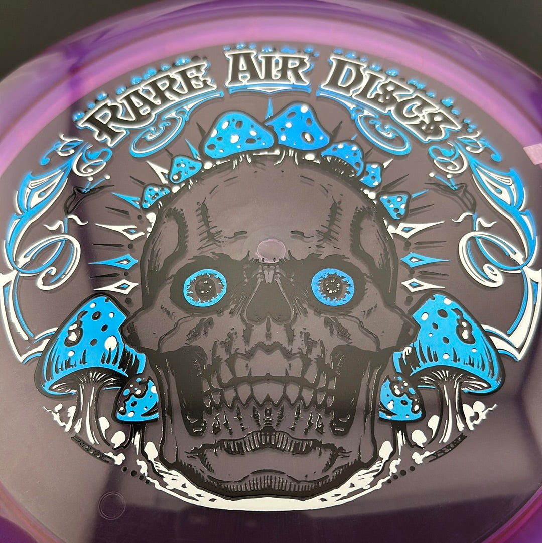 Disc golf stamp by Manny Trujillo on Rare Air Discs Ethos Construct Crushin' Amanitas disc, featuring vibrant mushroom artwork.