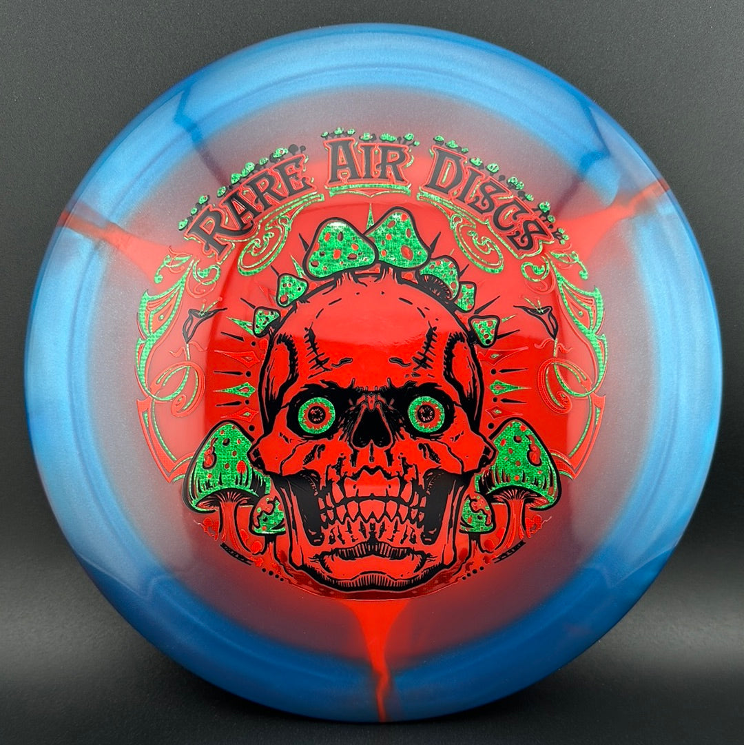 Rare Air Discs Halo S-Blend Conqueror disc golf disc featuring Crushin' Amanitas artwork by Manny Trujillo.