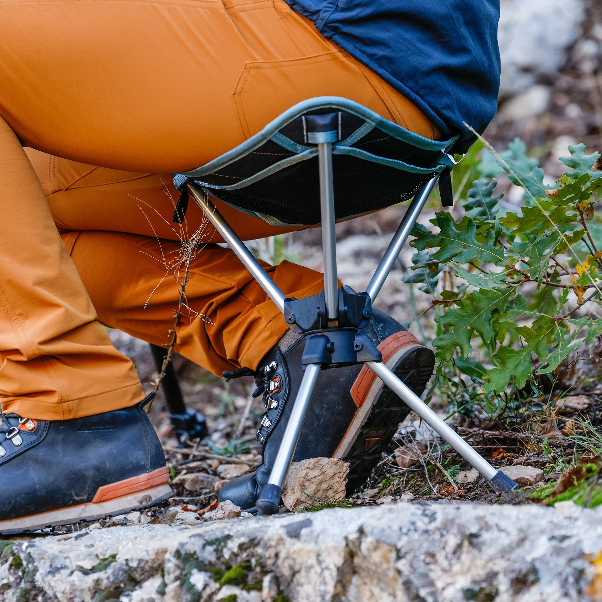 GrandTrunk Compass 360° Swivel Stool with a durable design for outdoor recreation in a natural setting.