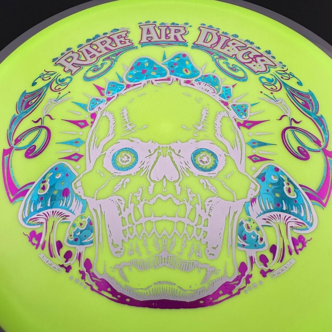 Disc golf disc Fission Defy Crushin' Amanitas VIP 2.0 by Manny Trujillo, featuring vibrant colorful design and logo.