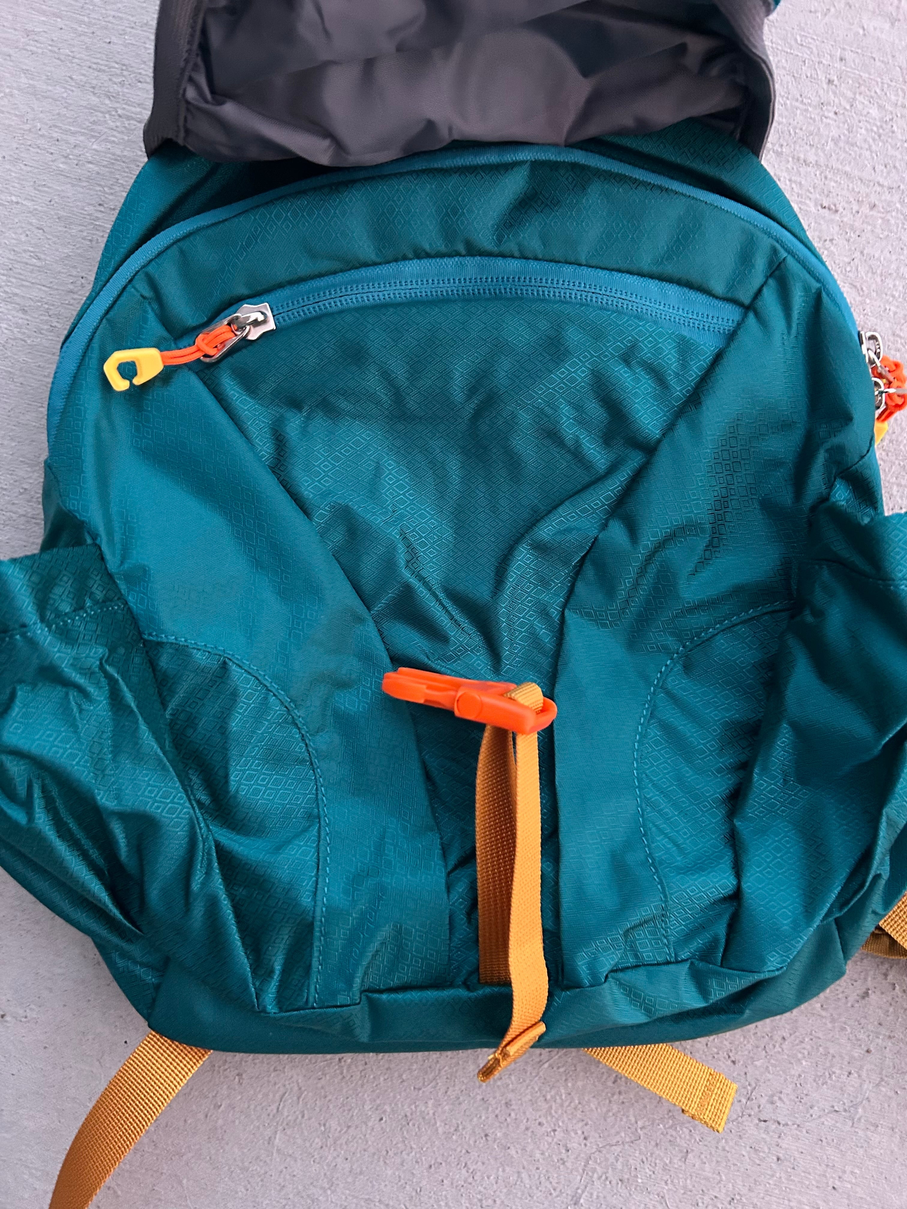 Kid’s teal hiking backpack by Keep the Littles Wild with water bladder compartment, adjustable straps, and durable outdoor design.