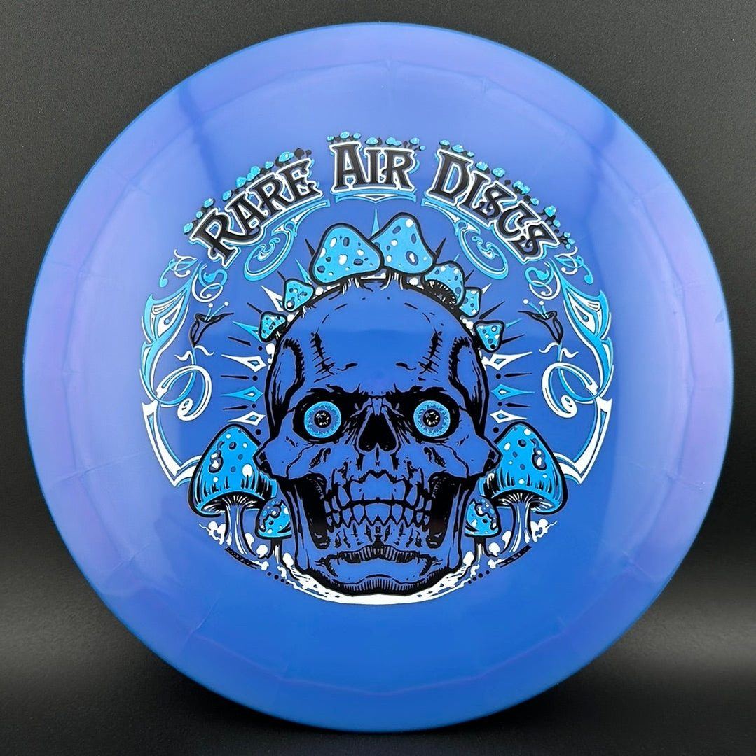 Ethereal Construct Crushin' Amanitas disc golf stamp by Manny Trujillo on a Rare Air Discs disc with colorful mushroom design.