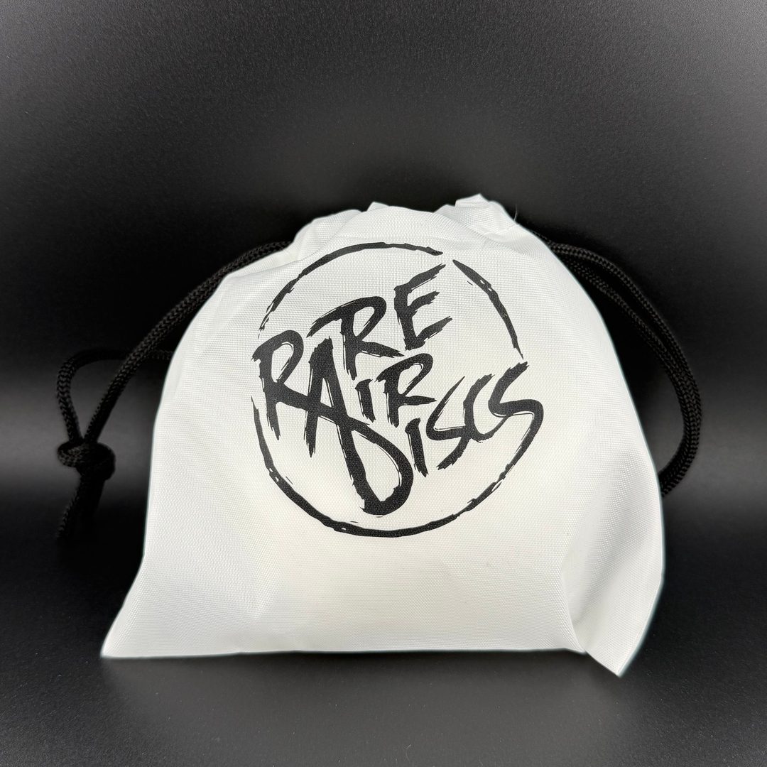 Rare Air Discs chalk ball with RAD bag and carabiner, grip enhancer accessory for improved handling in sports or disc golf.
