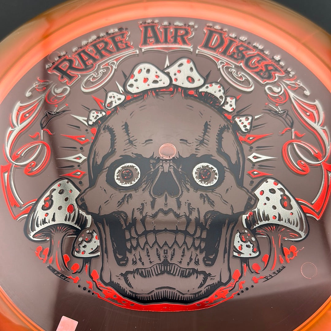 Ethos Construct Crushin' Amanitas disc golf stamp by Manny Trujillo on Rare Air Discs disc, featuring colorful mushroom artwork.