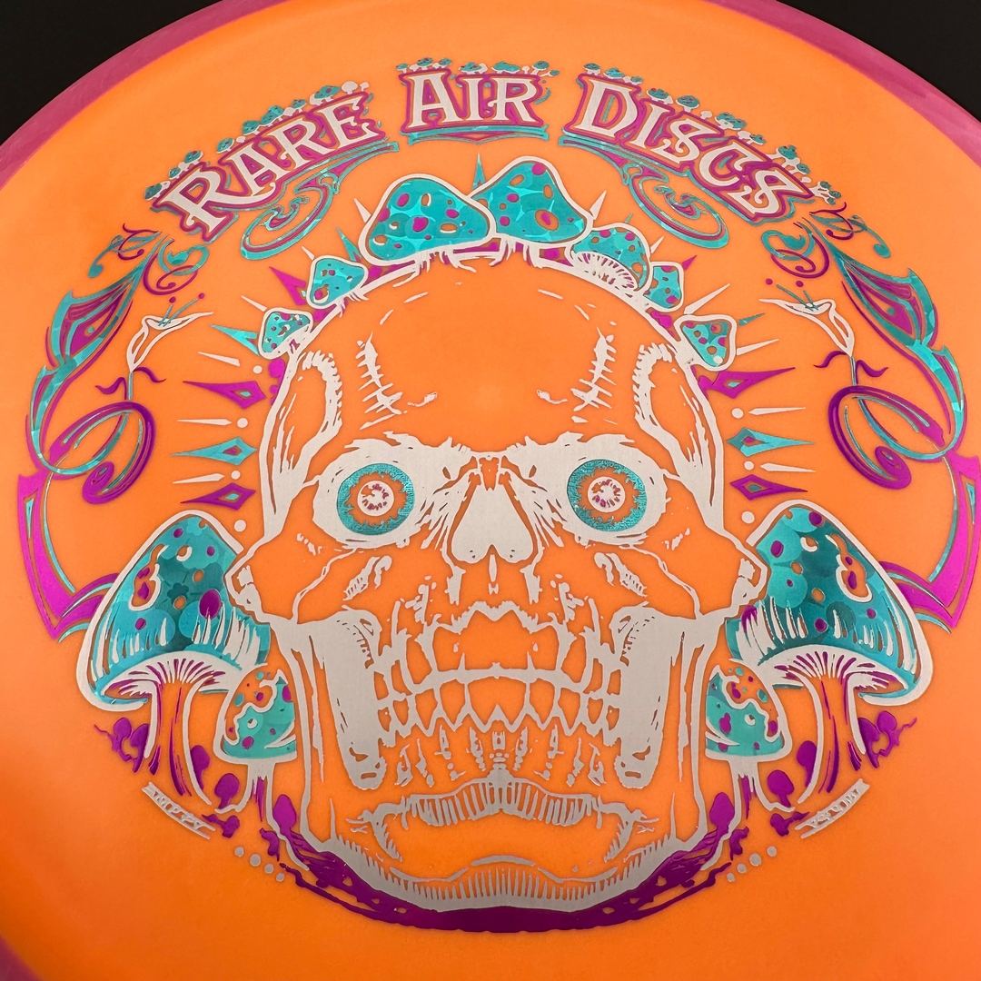 Rare Air Discs Fission Defy Crushin' Amanitas VIP 2.0 disc golf disc with vibrant design and detailed artwork visible.