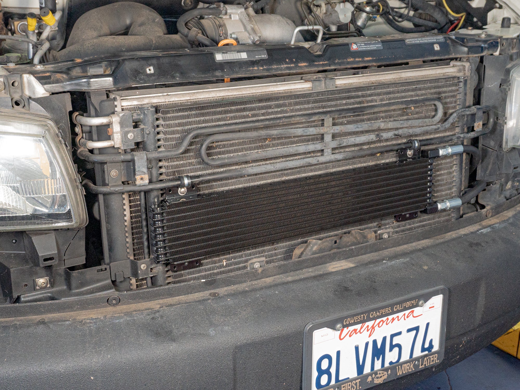 GoWesty external cooler kit for Eurovan automatic transaxle, installed with hoses and mounting components visible.