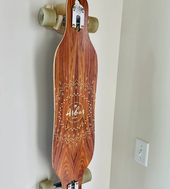 Rado Racks Elevator skateboard and longboard wall rack holding a skateboard for organized display and storage.