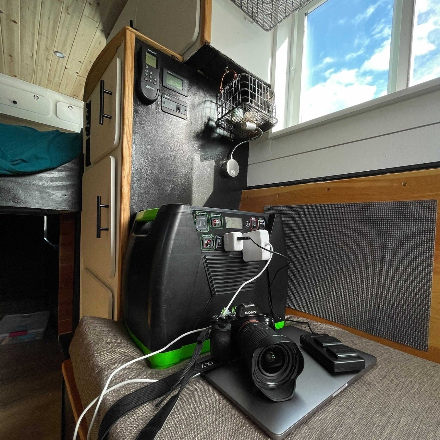 Nature's Generator Elite Gold portable power system in an RV, showcasing its compact design and digital display for electronics use.