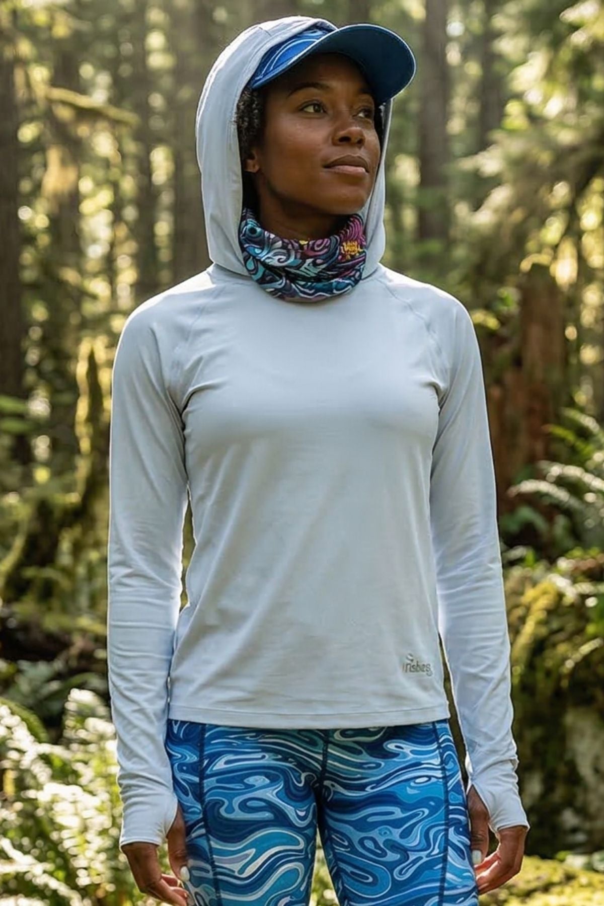 FisheWear Enchanted Grayling neck tube showing a comfortable, stretchy gray fabric with a subtle pattern, worn around the neck.