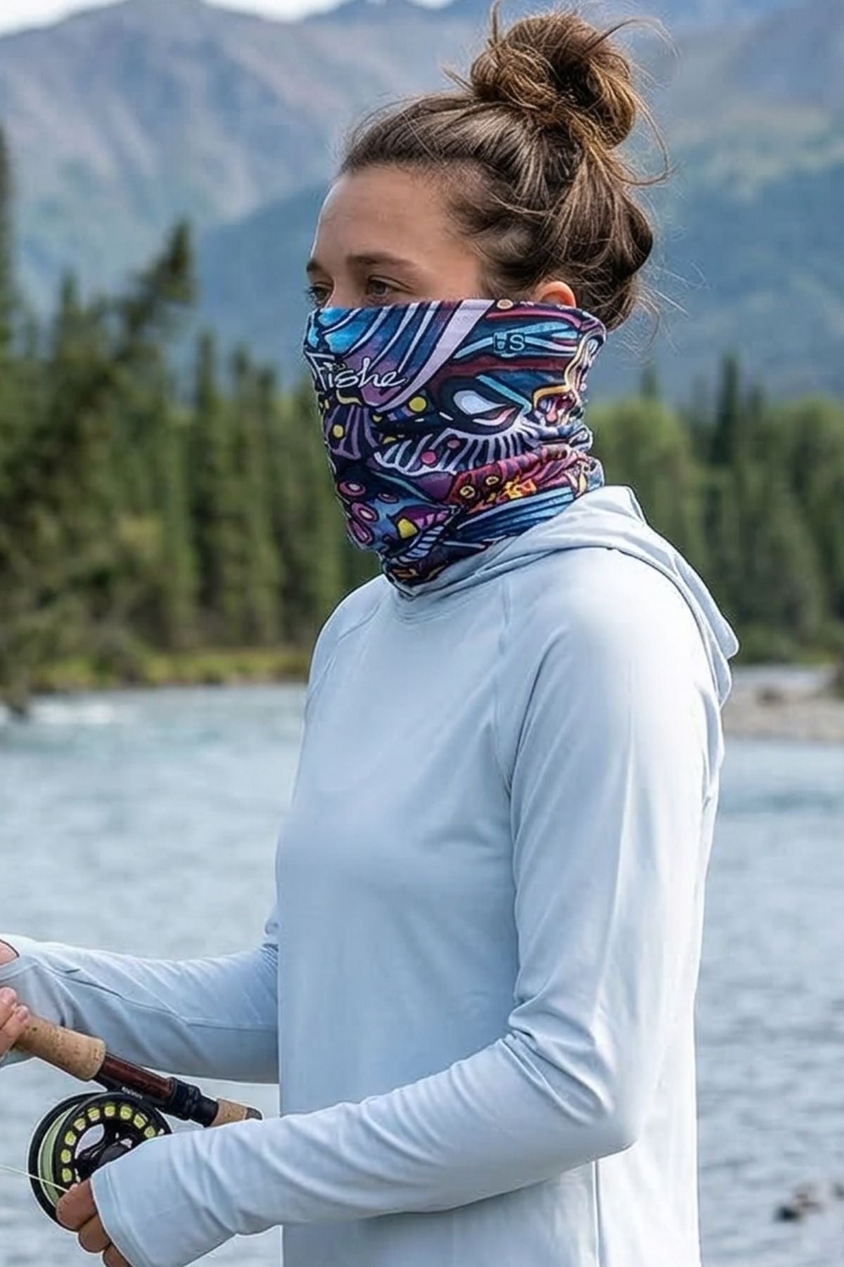 FisheWear Enchanted Grayling neck tube featuring a gray and blue aquatic pattern, made of stretchy fabric for versatile wear.