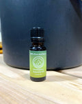 Bottle of North Shore Sauna eucalyptus essential oil with a clear label, showing the natural, aromatic oil inside.