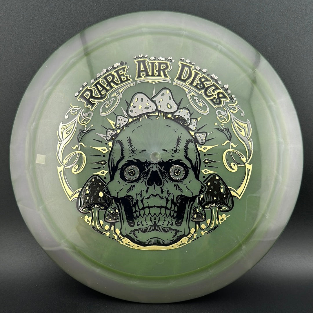 Rare Air Discs Ethos Construct Crushin' Amanitas disc golf stamp by Manny Trujillo featuring colorful mushroom artwork on a disc.