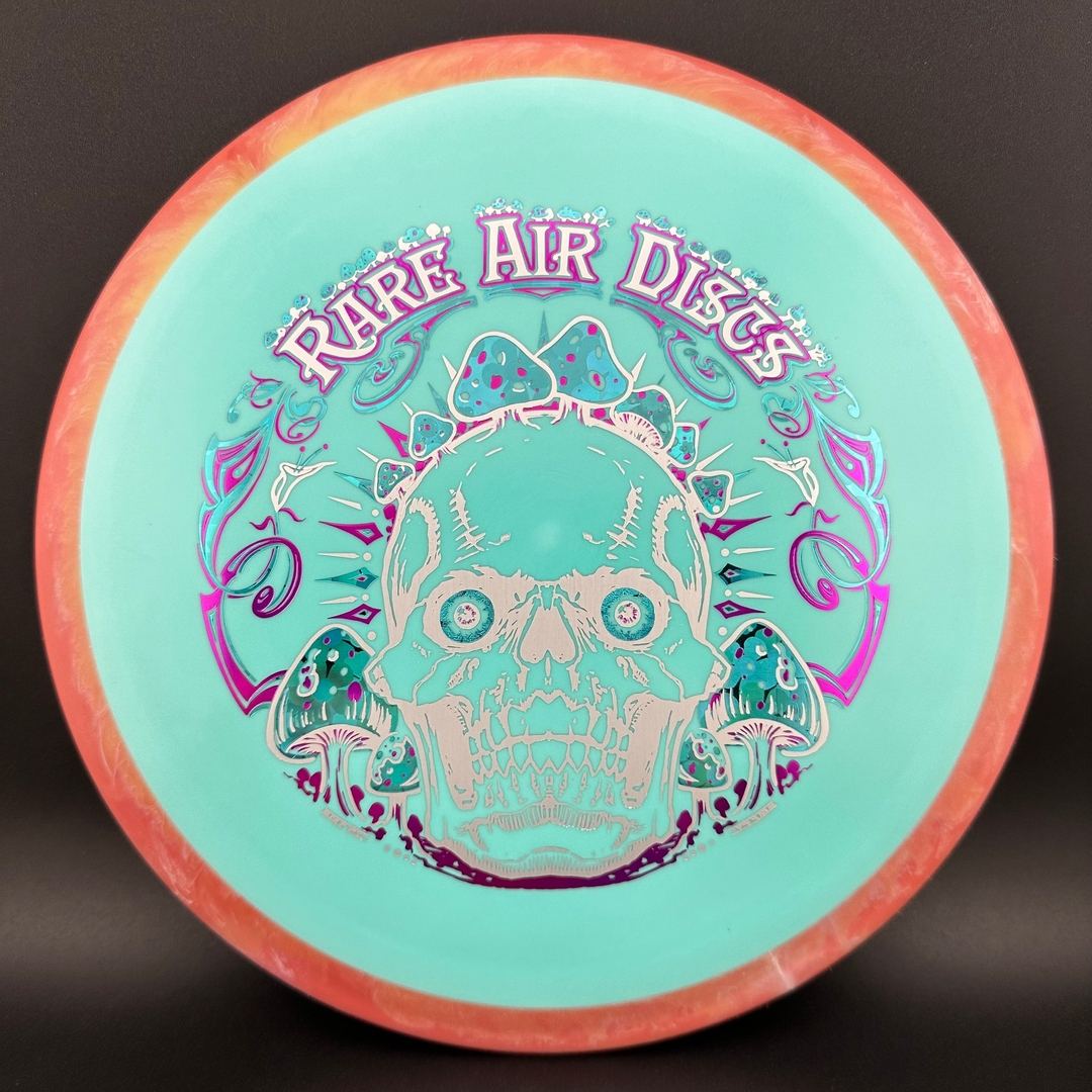 Rare Air Discs Fission Defy Crushin' Amanitas VIP 2.0 disc golf disc with vibrant design and bold lettering.