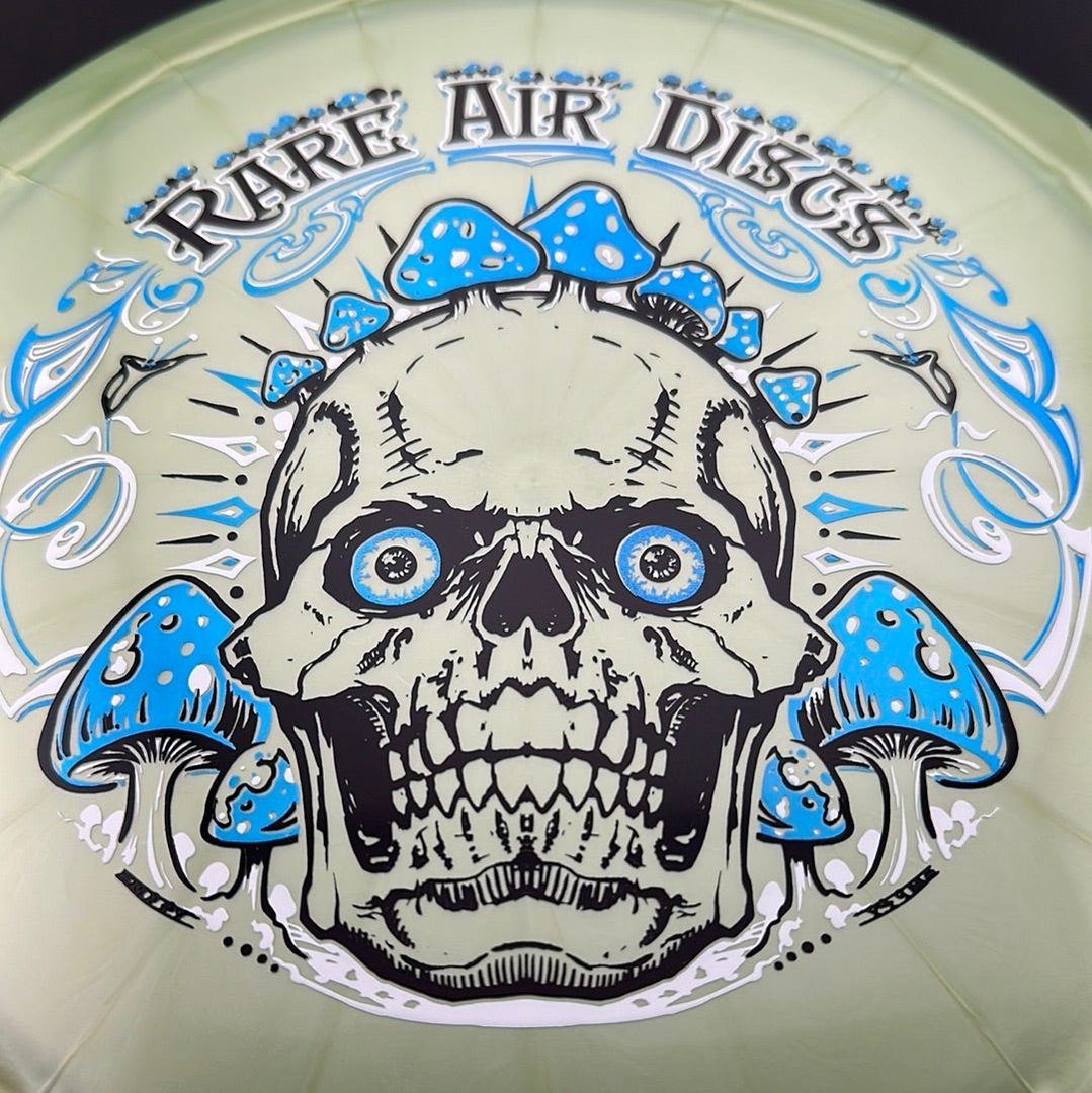 Ethereal Construct Crushin' Amanitas disc golf stamp by Manny Trujillo on a Rare Air Discs disc, featuring vibrant mushroom artwork.