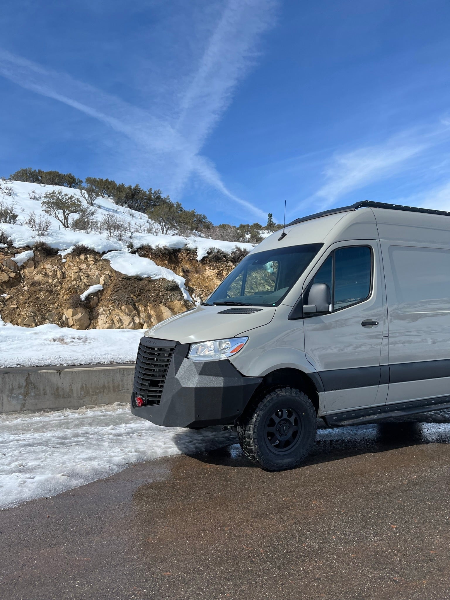 Avatar Offroad Ultra Rack low profile roof rack installed on a Sprinter van, providing durable cargo storage for van roof.