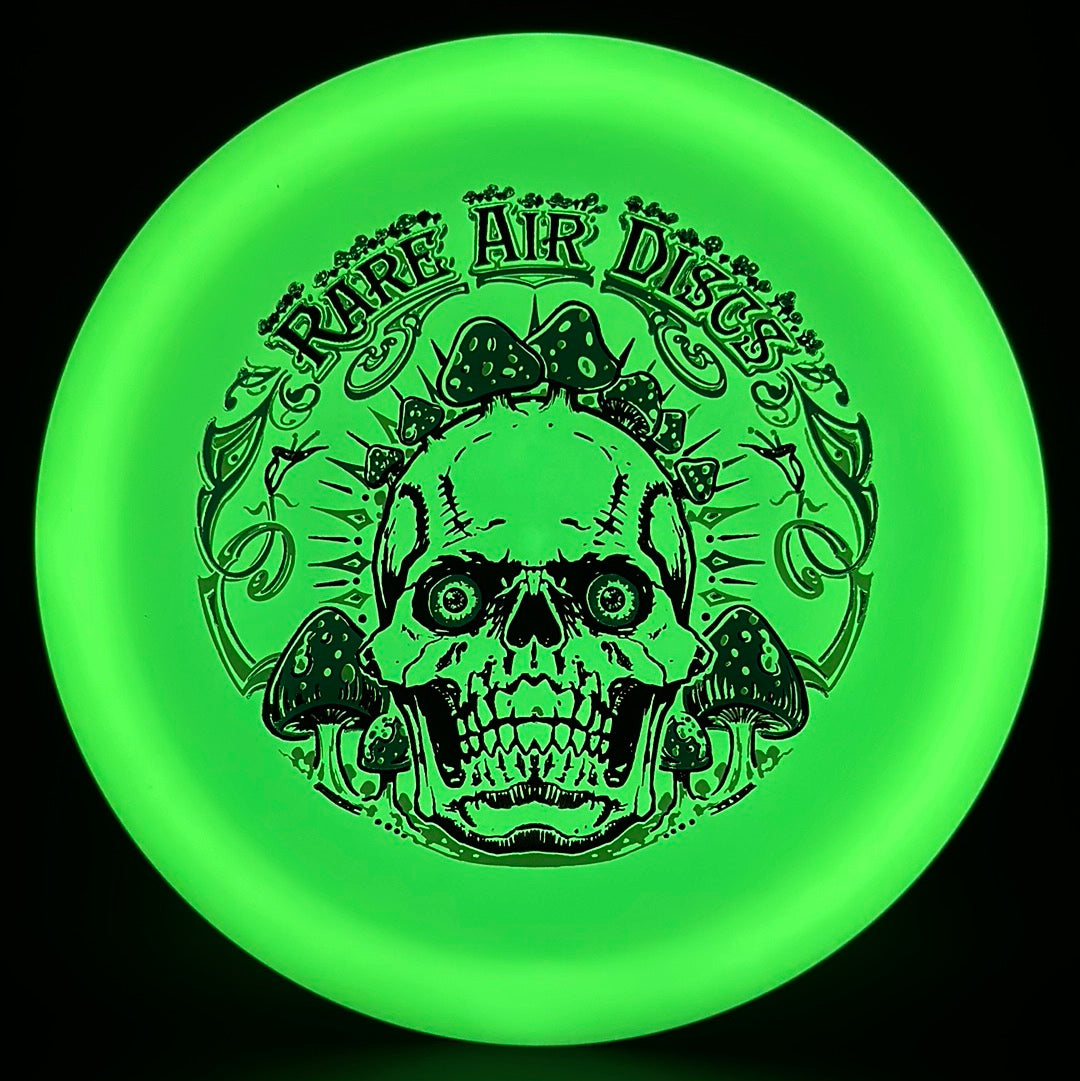 Forged Radiant Era Crushin' Amanitas disc golf stamp by Manny Trujillo on a Rare Air Discs disc, featuring detailed mushroom artwork.