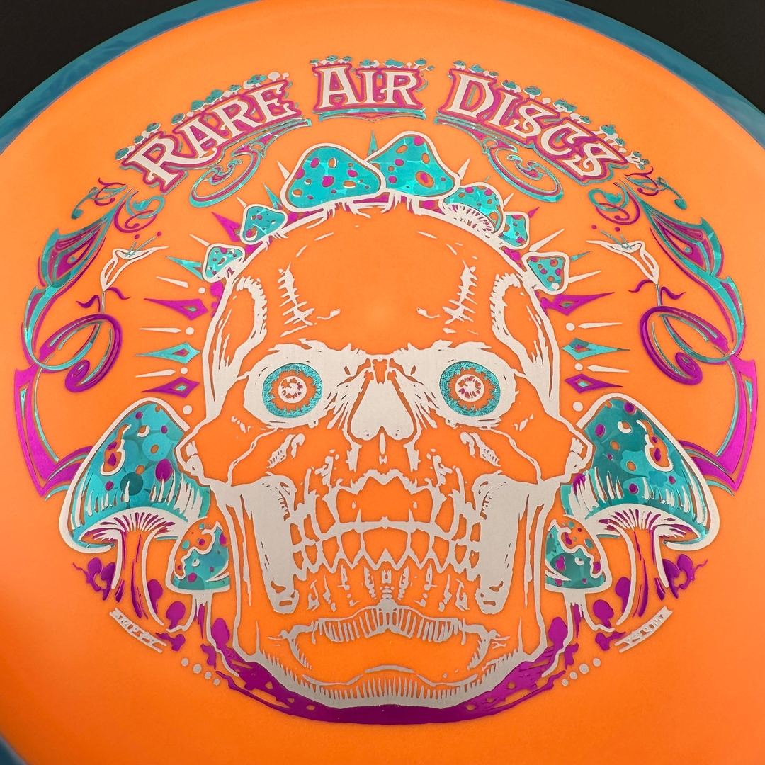 Fission Defy Crushin' Amanitas VIP 2.0 disc golf disc by Rare Air Discs, showcasing vibrant design and flight features.
