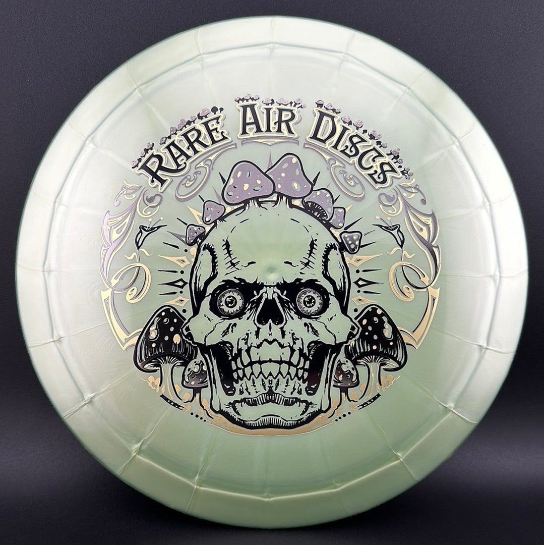 Ethereal Construct Crushin' Amanitas disc golf stamp by Manny Trujillo on a Rare Air Discs disc, featuring vibrant mushroom artwork.