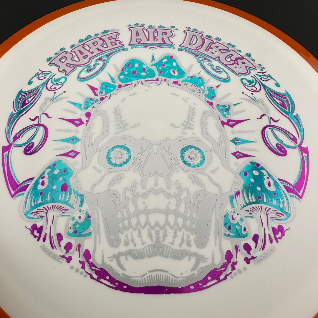 Fission Defy Crushin' Amanitas VIP 2.0 disc golf disc by Rare Air Discs, featuring vibrant design and professional-grade plastic.