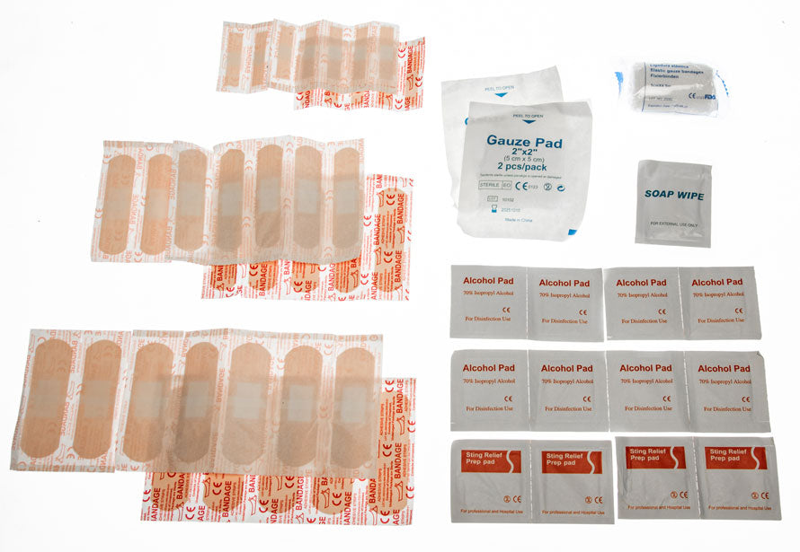 Travel First Aid Kit 55pc in waterproof bag, compact kit with bandages, antiseptic wipes, and first aid supplies for emergency use.