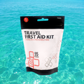Travel First Aid Kit 55pc in waterproof reusable bag, compact emergency medical kit from quakekits.com with first aid supplies.
