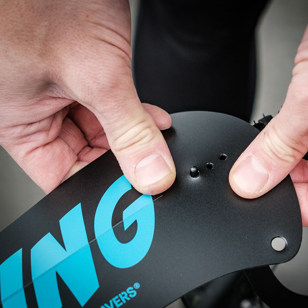 ZEITBIKE Ass Savers Win Wing 2 road rear mudguard with black wishbone attached to bike wheel for protection against mud and splash.