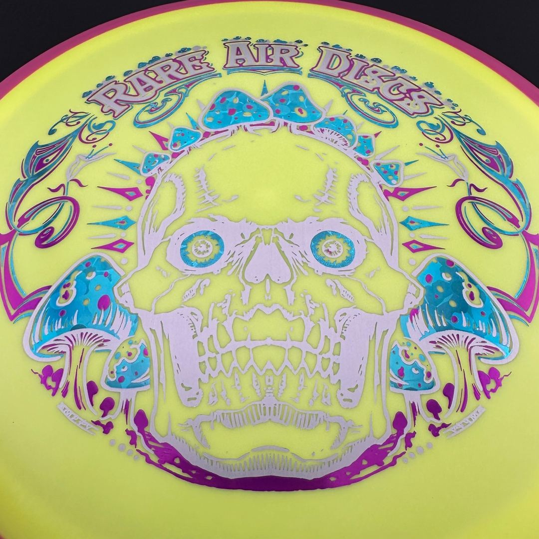 Fission Defy Crushin' Amanitas VIP 2.0 disc golf disc by Rare Air Discs, showing vibrant design and flight surface.
