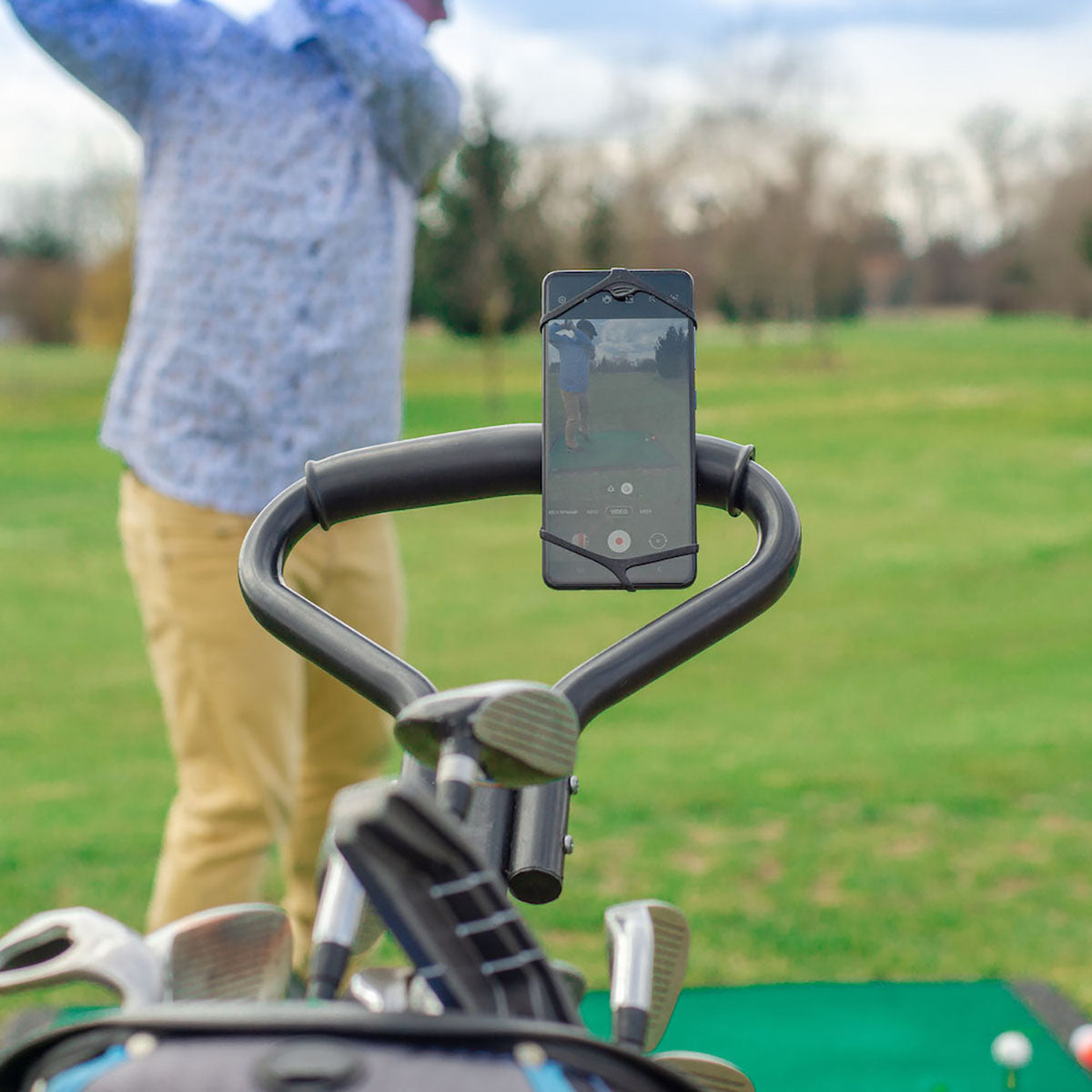 ZEITBIKE FINN universal golf phone mount holder attached to a golf cart for secure smartphone placement during play.