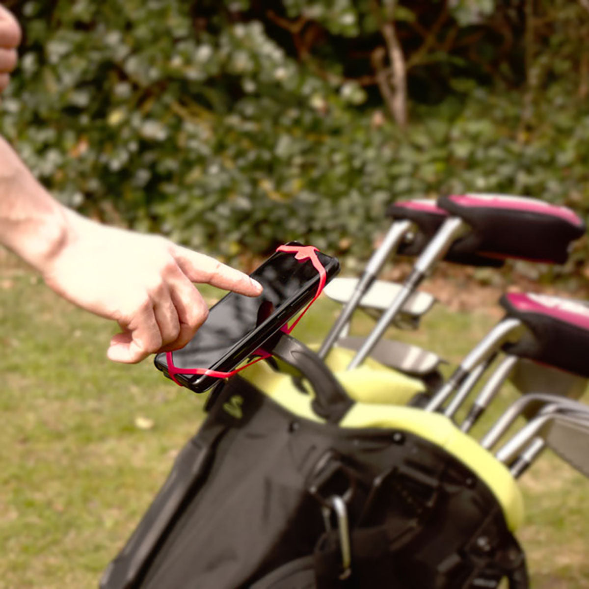 ZEITBIKE FINN universal golf phone mount holding a smartphone on a golf cart, secure and adjustable phone holder for golf accessories.