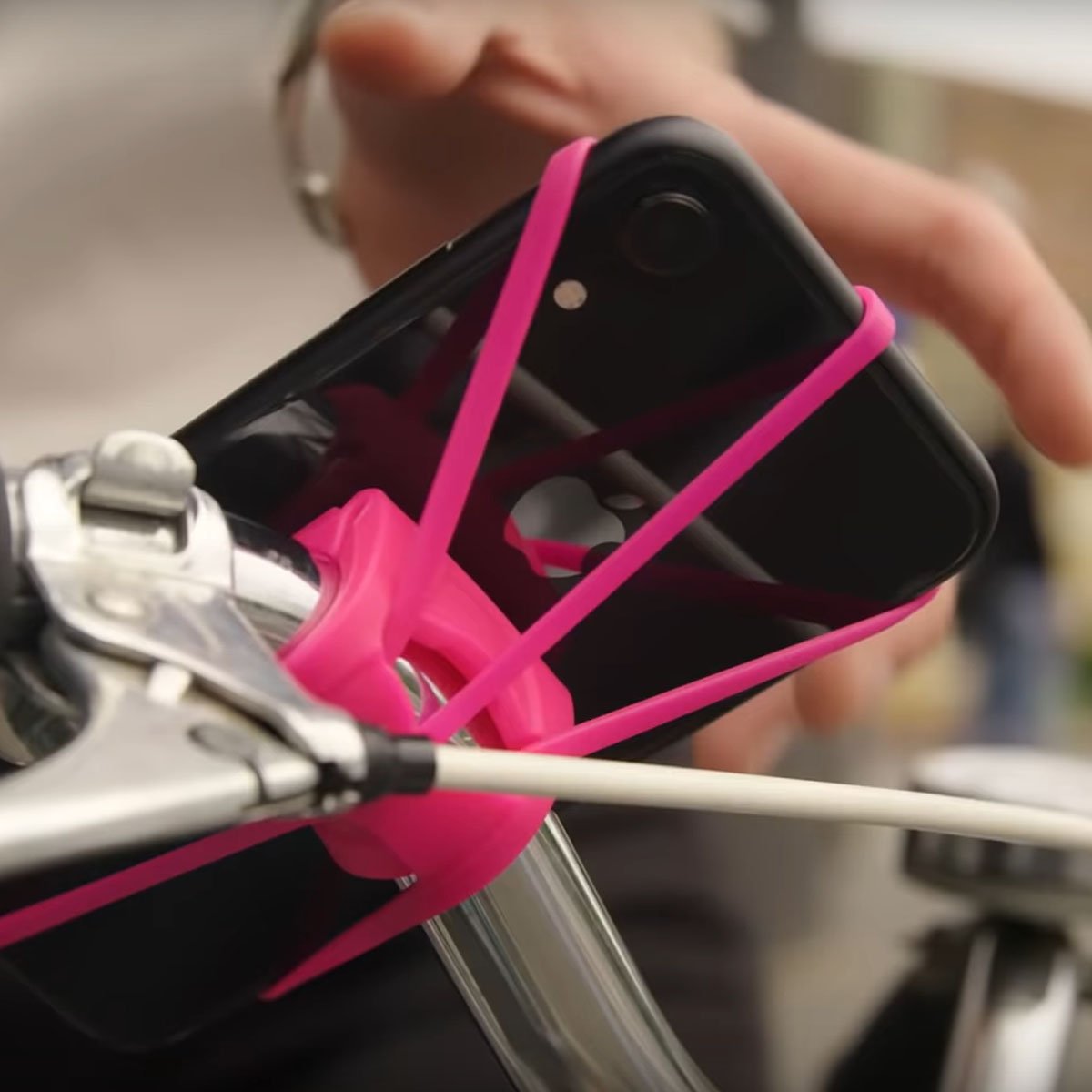 ZEITBIKE FINN universal bicycle phone mount in red securely holds smartphones during rides.
