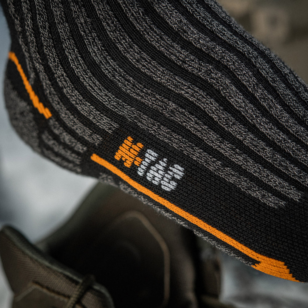 M-Tac Coolmax mid calf socks in black, showcasing breathable fabric and long design for comfort and performance.