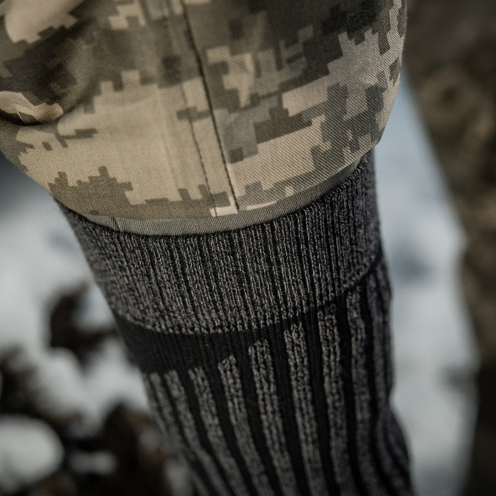 M-Tac Coolmax mid calf socks in a long design, showcasing breathable fabric and ergonomic fit for comfort.