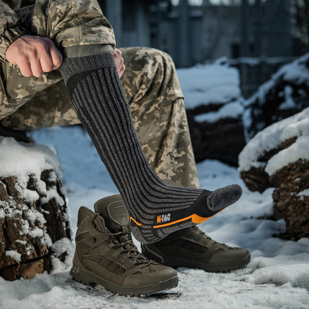 M-TAC Coolmax mid calf socks in grey, designed for comfort and breathability, showcasing a durable and stylish knit pattern.