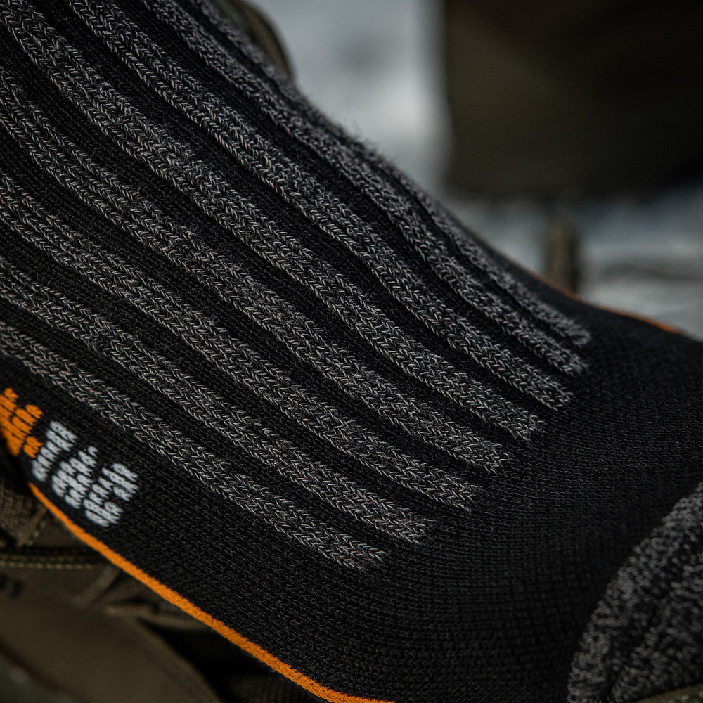 M-Tac Coolmax long mid calf socks in a breathable design, showcasing fabric texture and fit.