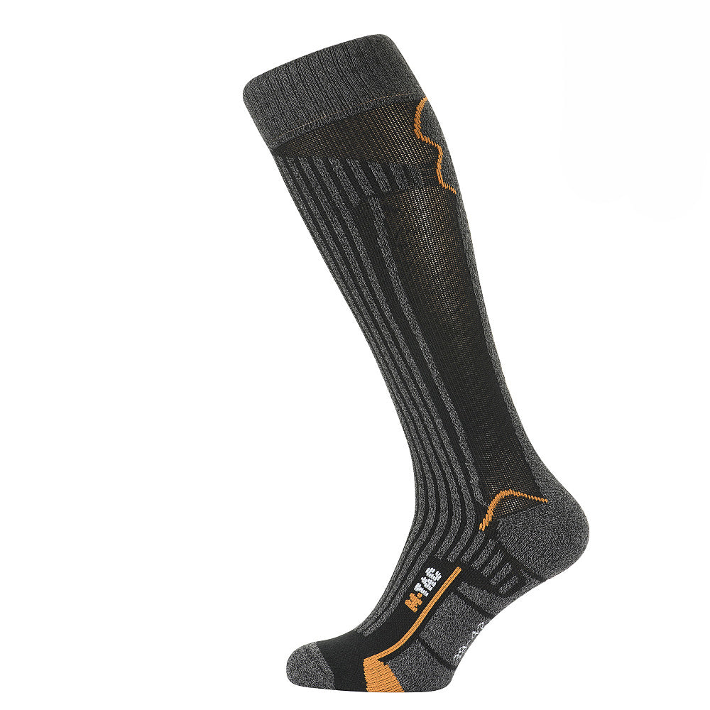M-Tac Coolmax long mid calf socks in a comfortable fit, showcasing breathable fabric and durable design.