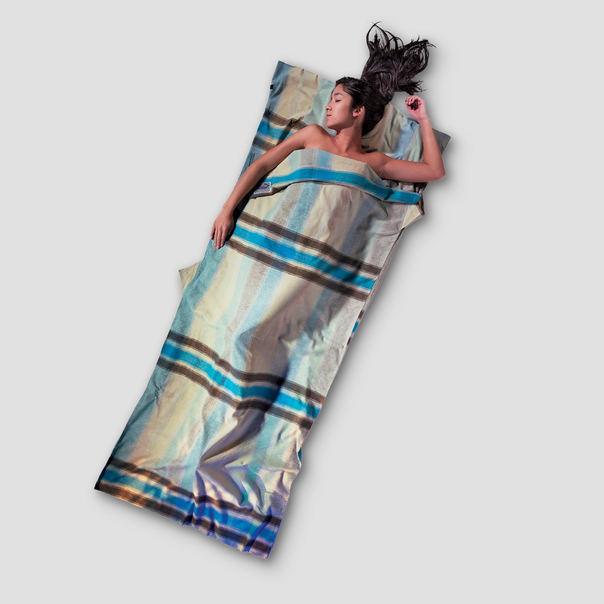 Cotton Flannel TravelSheet™ by COCOON, showing soft, cozy fabric in a compact, portable size for travel comfort.