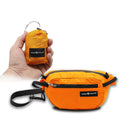 Orange Pike Trail fanny pack with adjustable strap and multiple pockets, designed for outdoor activities and convenience.