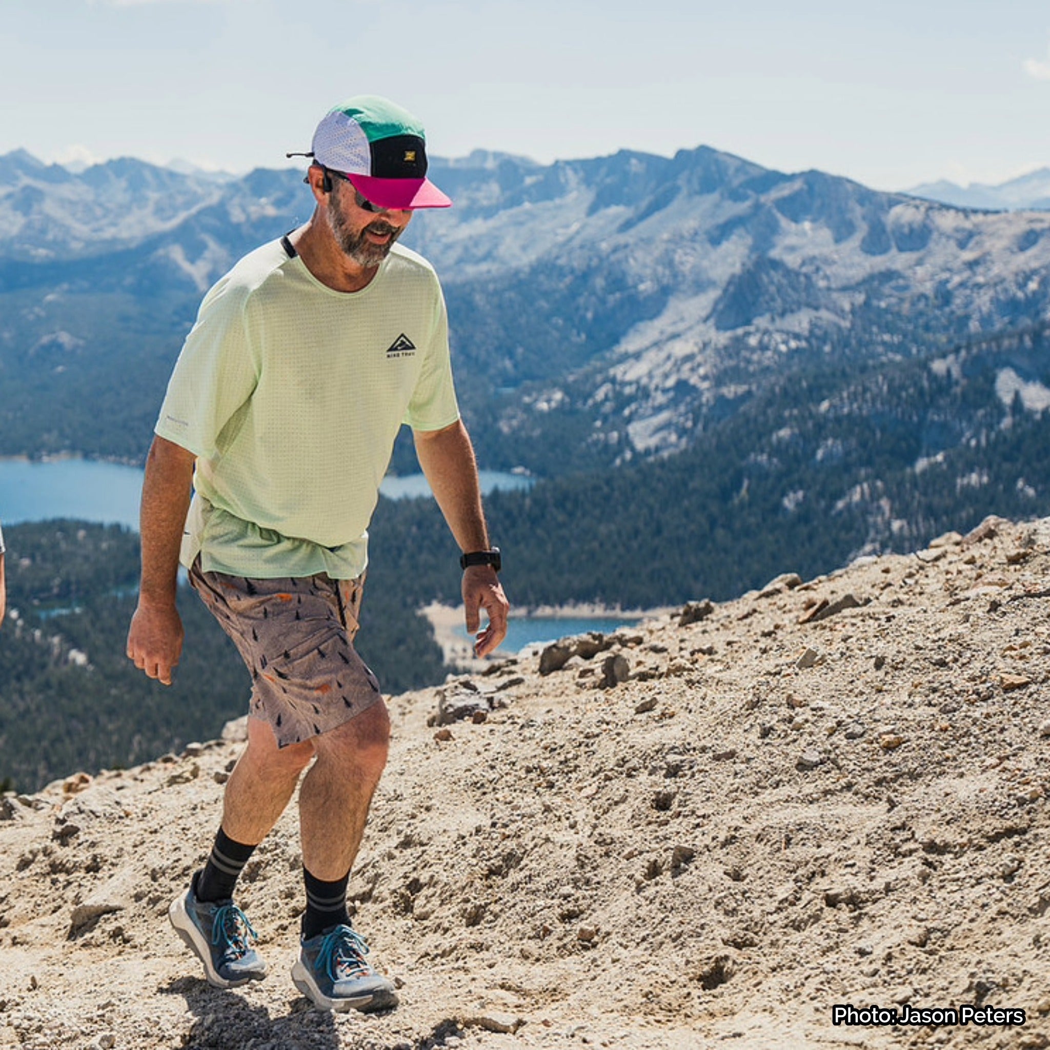 Faultline395 crushable 5-panel camper hat in seafoam and fuchsia with adjustable strap, lightweight and foldable for outdoor wear.