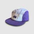 Faultline395 crushable 5-panel camper hat in purple and gray, featuring a flexible design and adjustable strap.