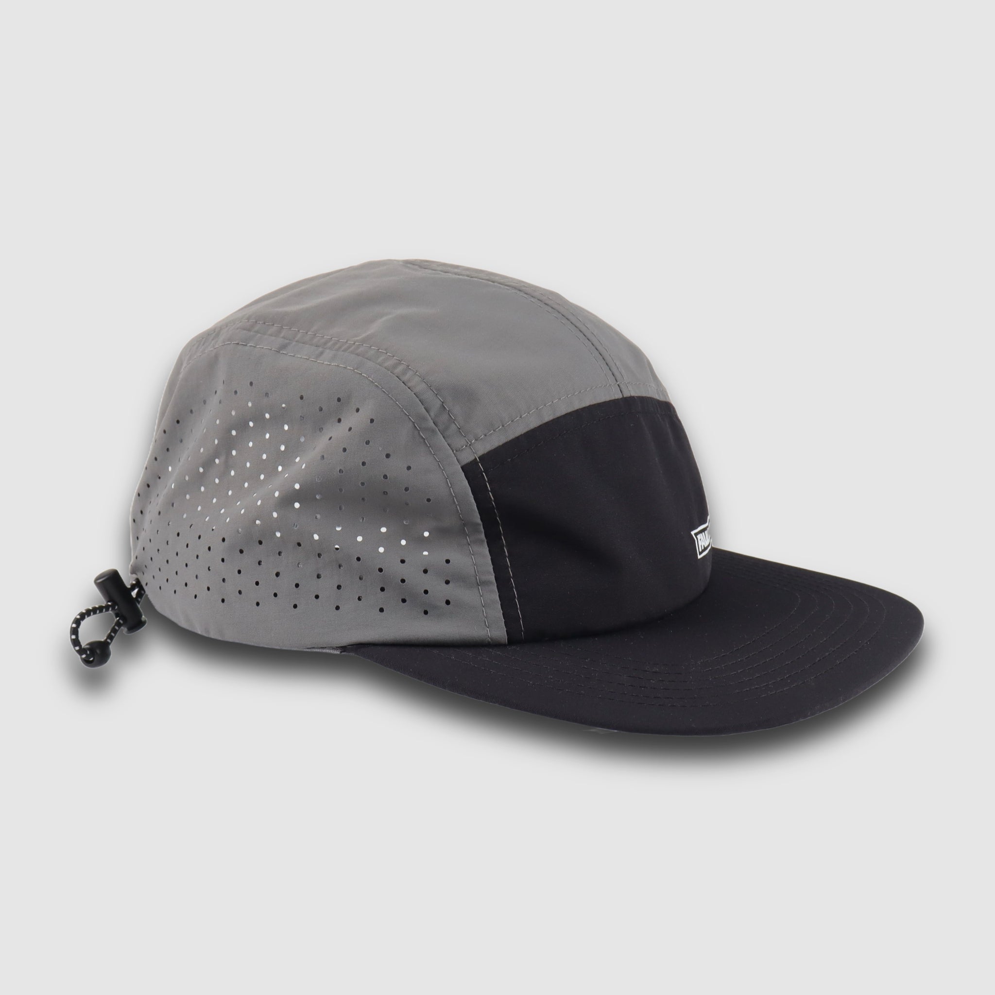 Faultline395 crushable 5-panel camper hat in black and grey with a flexible, foldable design and adjustable strap.