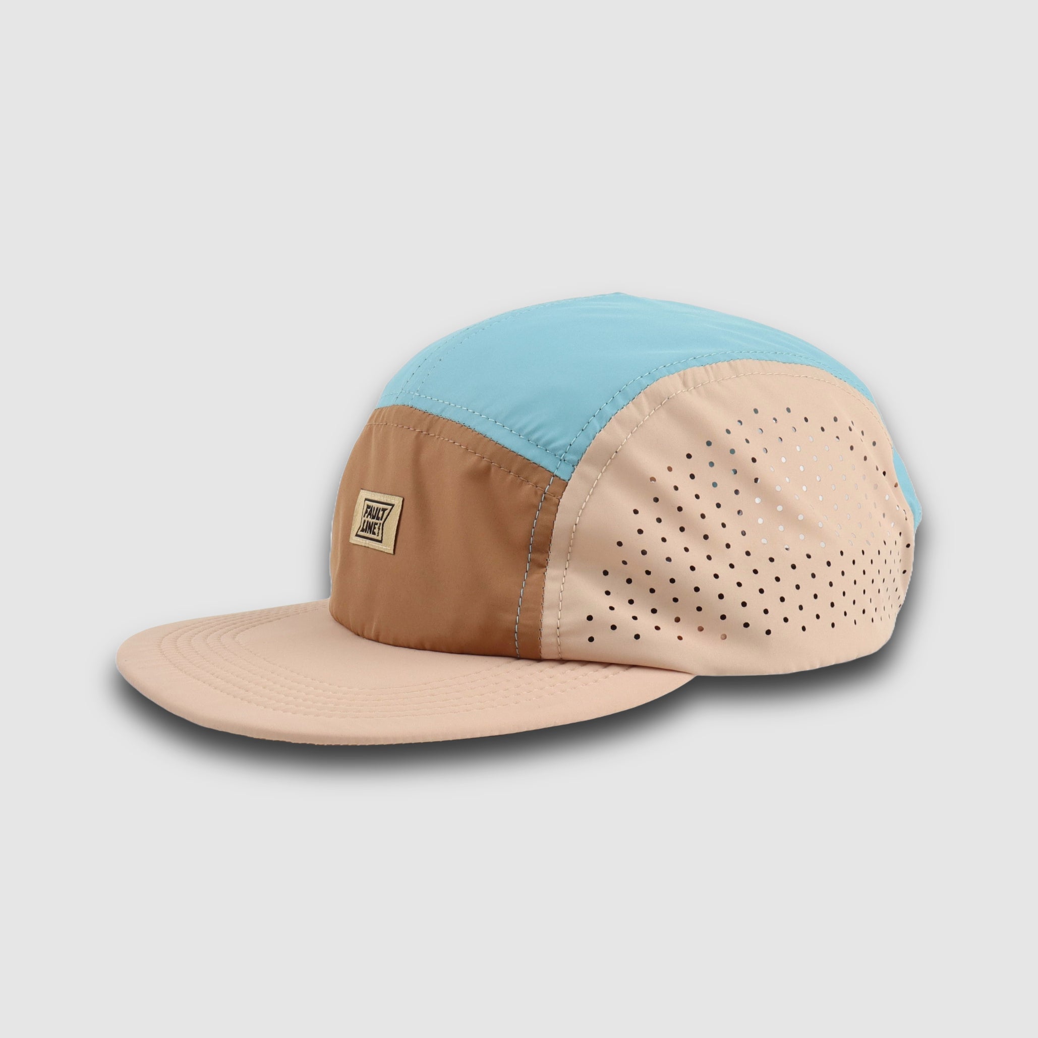 Tan and teal crushable 5-panel camper hat by Faultline395 with a flexible brim and breathable fabric.