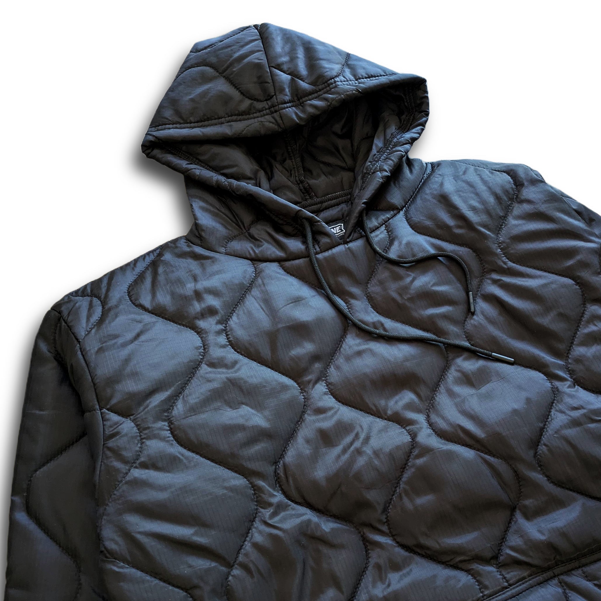Black Sherwin Puff Hoodie by Faultline395, featuring a cozy padded design and drawstring hood.