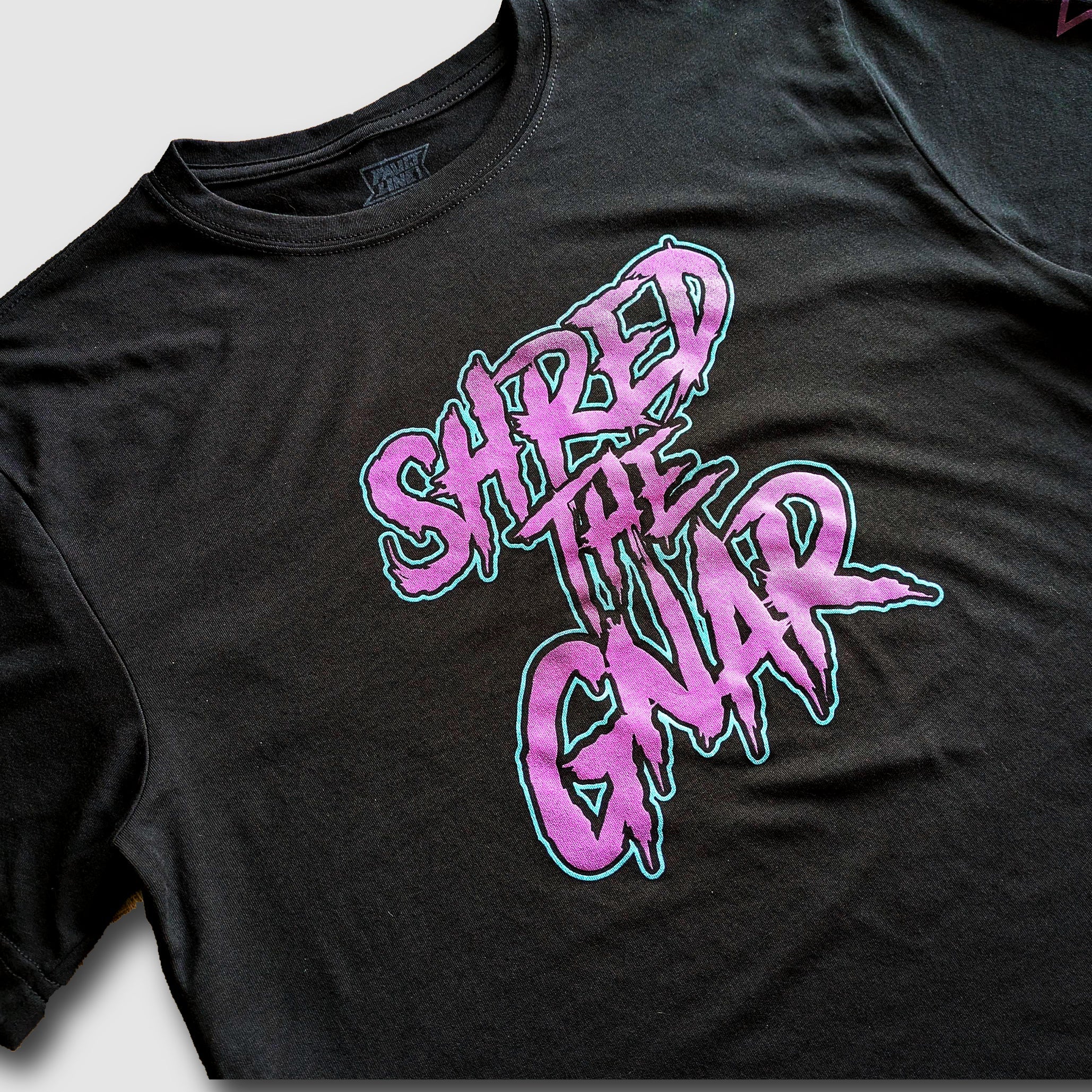 Black Faultline395 Shred the Gnar sustainable T-shirt with graphic design, casual fit, and eco-friendly fabric.