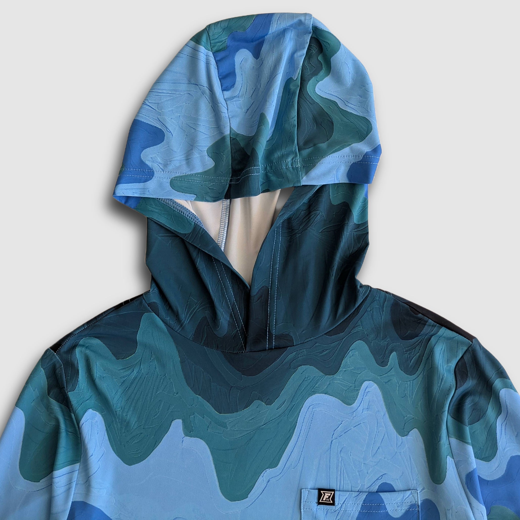 Women's Faultline395 Carson Sun Hoodie featuring mountain wave design, lightweight sun protection, and comfortable fit.