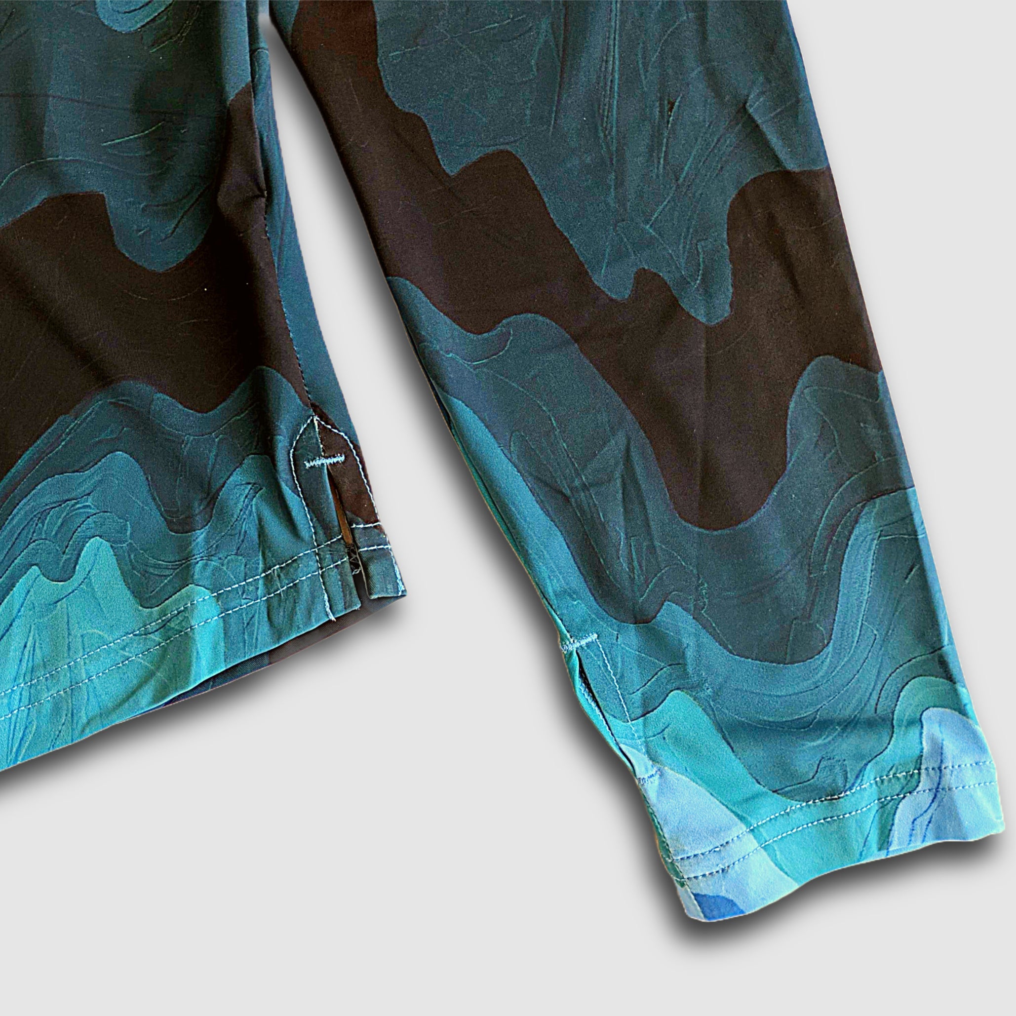 Women's Faultline395 Carson Sun Hoodie with Mountain Waves print, featuring lightweight fabric and hood for sun protection and casual wear.