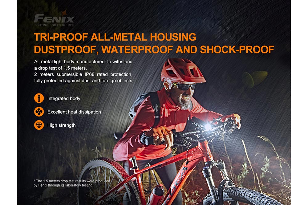Fenix BC26R LED bike light with waterproof design, mounted on a bike, illuminating a rainy path.
