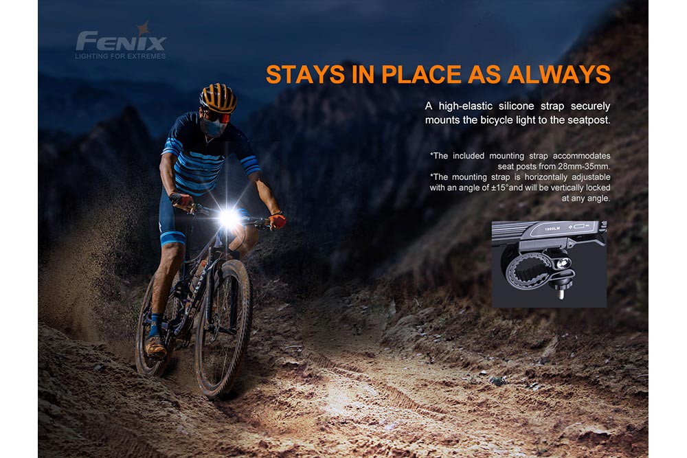 Fenix BC26R LED bike light mounted securely on a bicycle, illuminating a path in a dark outdoor setting.