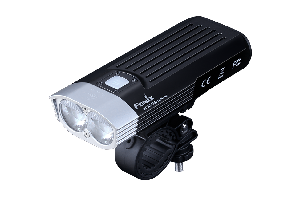 Fenix BC30 V2 LED bike light with dual beams and adjustable brightness mounted on a bicycle handlebar.