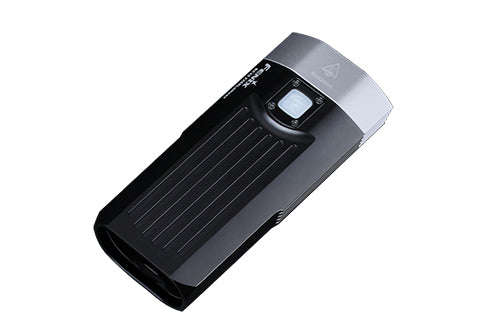 Fenix BC30 V2 LED bike light featuring dual beams and a compact design, mounted on a bicycle handlebar.