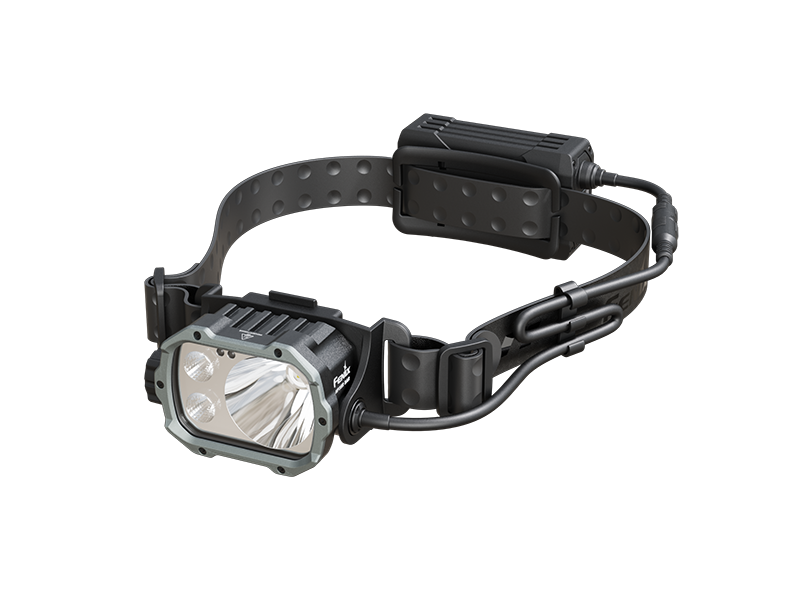 Fenix HP35R search and rescue headlamp showing side view with adjustable strap and bright LED light for outdoor use